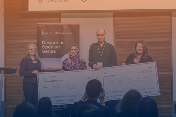 Deaf AI - a TRP start up, being presented with a prize for U of T Entrepreneurship Week 2022