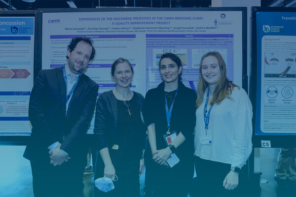 Group of TRP students standing in front of a poster at the LMPRC 2022