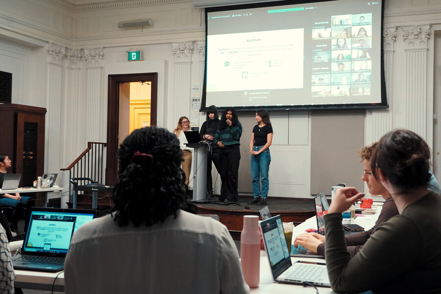 TRP students presenting their research projects in the auditorium at 263 McCaul St.