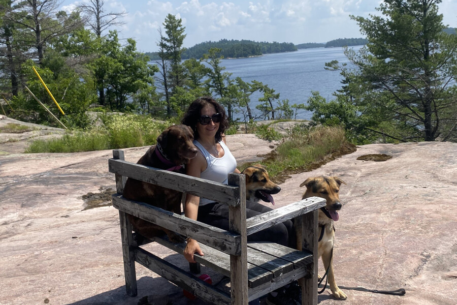 Dr. Edyta Marcon at the cottage with her dogs