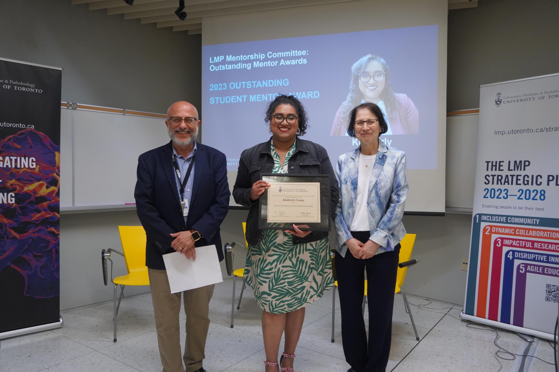 Kim Crasta (2nd year TRP student) receives the Outstanding Student Mentor Award, with Dr. George Yousef and Dr. Rita Kandel